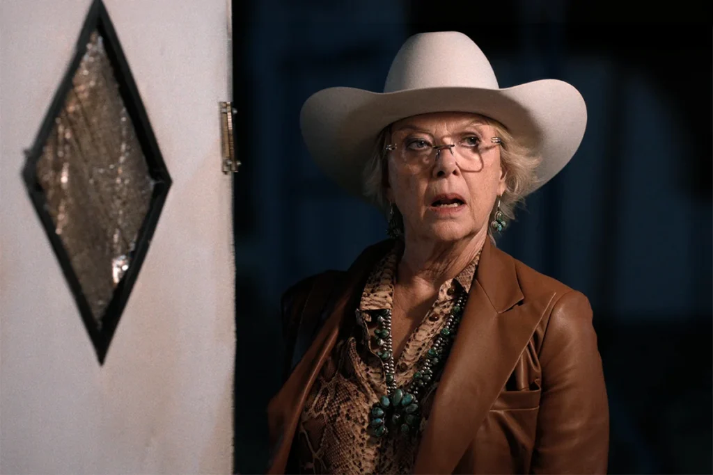 Beulah's tan leather blazer + snake print shirt on Dutton Ranch
