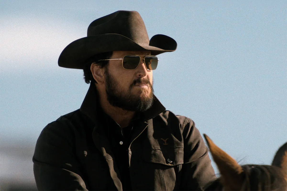 Rip's black Wrangler shirt + gold sunglasses on Dutton Ranch